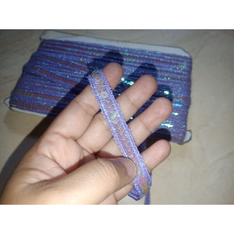 Renda meteran manik ungu gliter