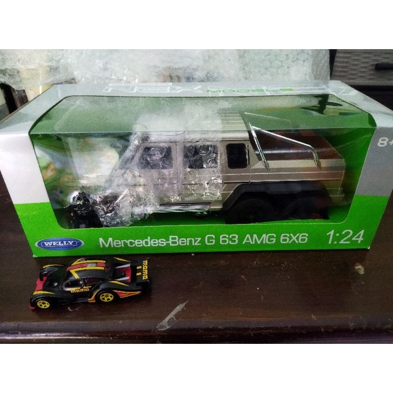 diecast mercedes benz g 63 amg 6x6 skala 1:24 merk welly