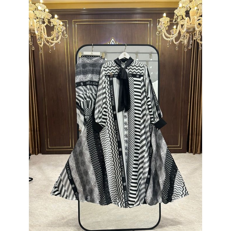 DRESS TERBARU SHELLA SAUKIA CROSS HITAM PUTIH BROCH HITAM