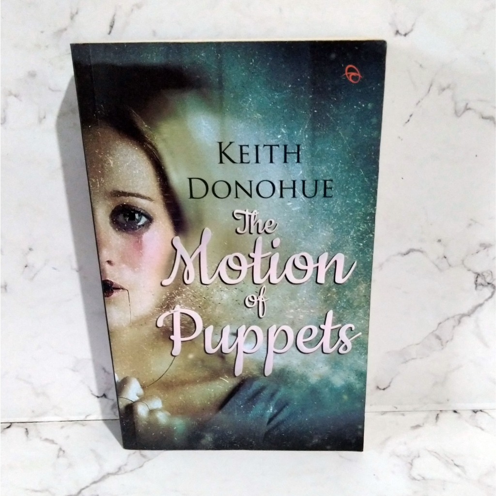 Novel The Motion of Puppets - Keith Donohue Penerbit Qanita