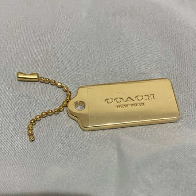 

hang tag coach gold ori