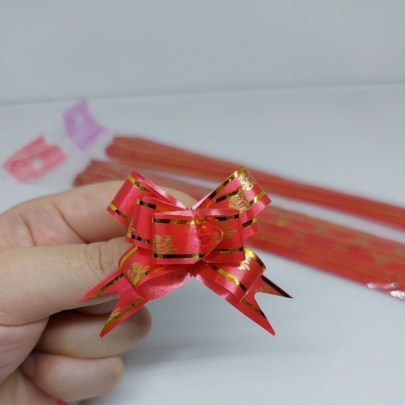 

Pita Serut Tarik Merah Shuang xi 12mm per 10pcs