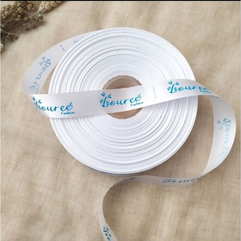 

merk baju label hijab satin putih lebar 1,3cm minimal 50lusin