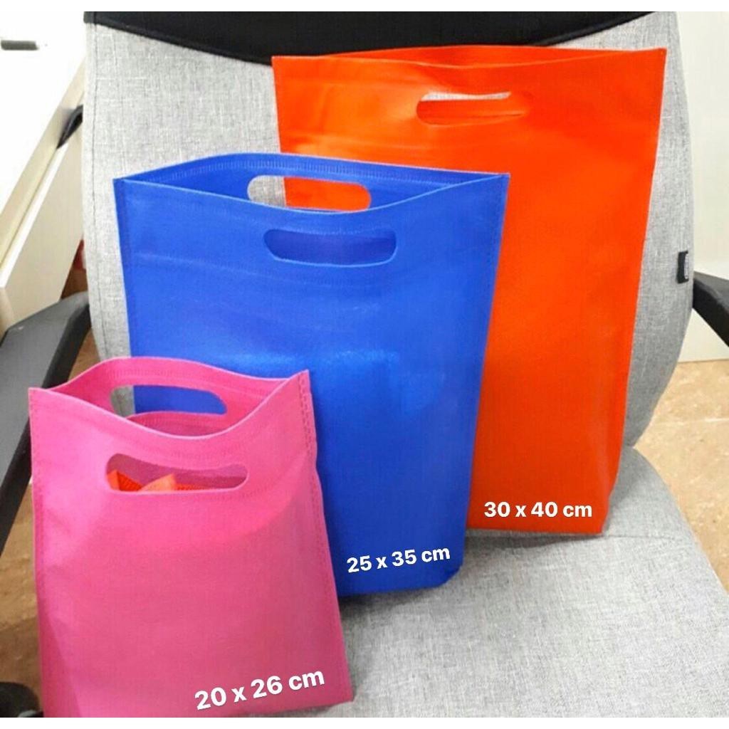 isi 20 pcs  tas kain spunbond plong 20x26 / 25x35 / 30x40