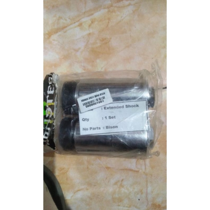 PENINGGI SHOCK DEPAN BYSON