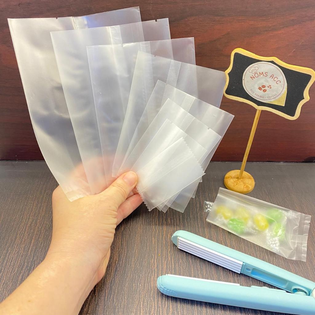 P2 - 100LEMBAR PLASTIK DOVE / PLASTIK SNACK / PLASTIK KUE POLOS / PLASTIK KUE KERING / PLASTIK MOONC