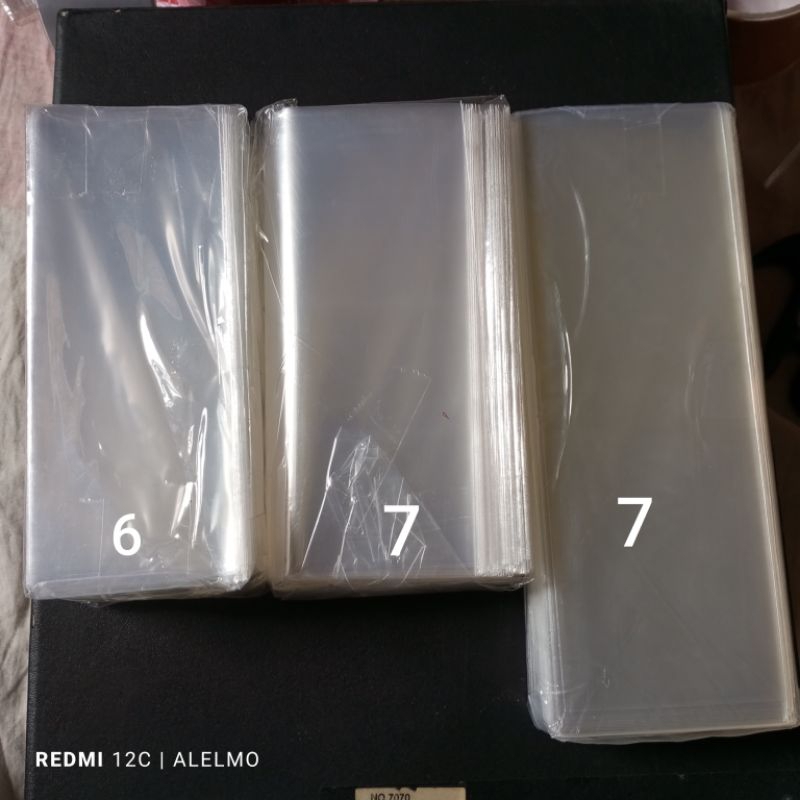 

pelindung tambahan plastik opp kaca bening tanpa perekat lem harga per100 lembar