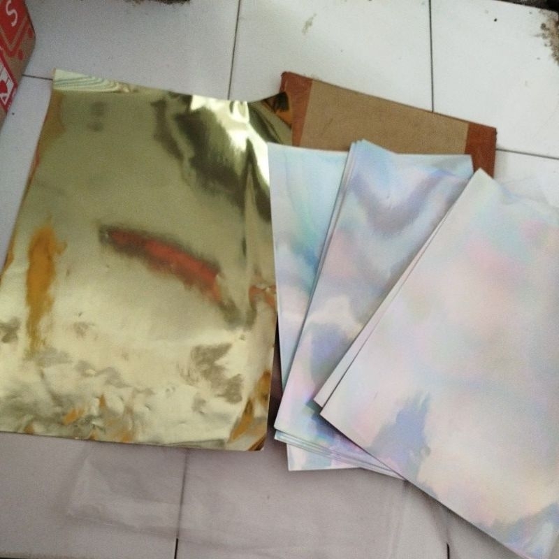 

Bahan stiker vinyl putih, transparan, gold, hologram A3 merk camel digiprint ( order borongan 30lbr )