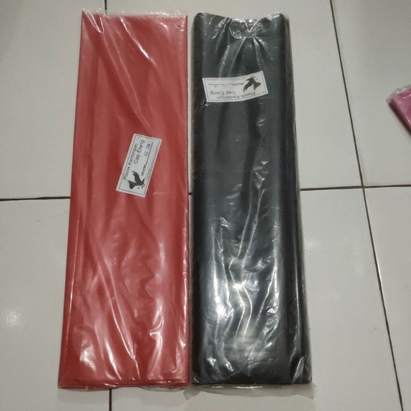plastik layangan cap elang merah dan hitam