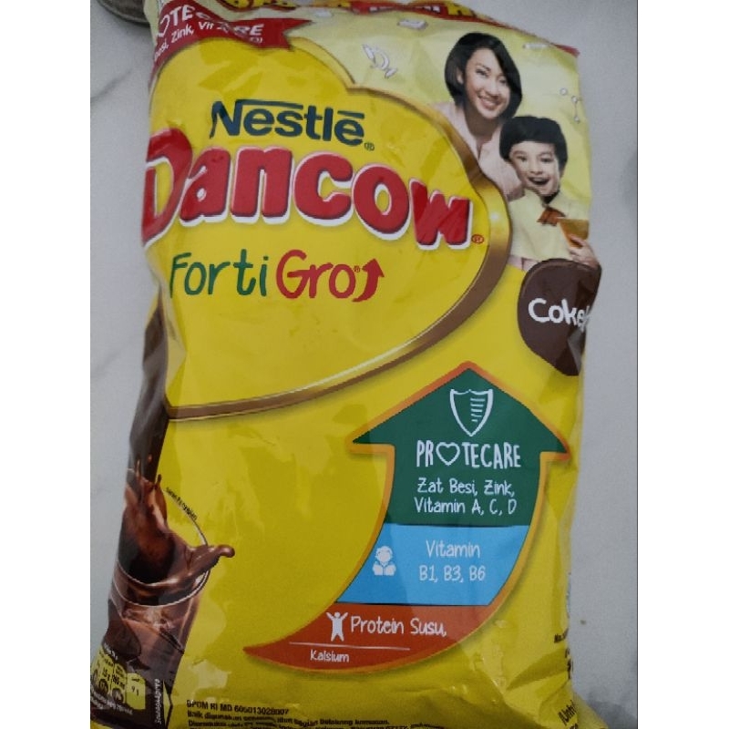 Dancow fortigro susu bubuk cokelat 1kg expired di gambar