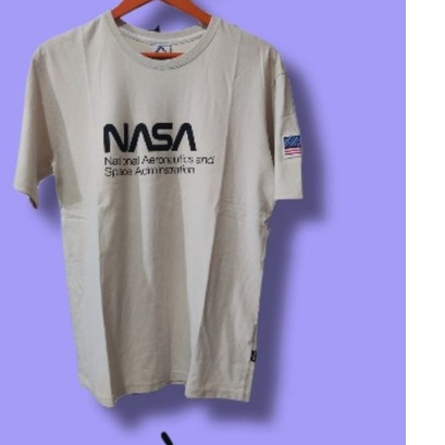 Fluke Kaos Unisex Size M Warna Cream Dengan Desain NASA National Aeronautics and Space Administratio