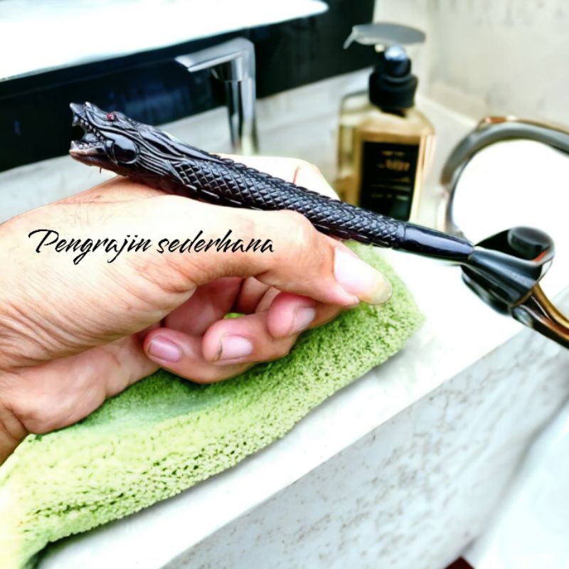 once pipa tanduk sapi ukir naga timbul