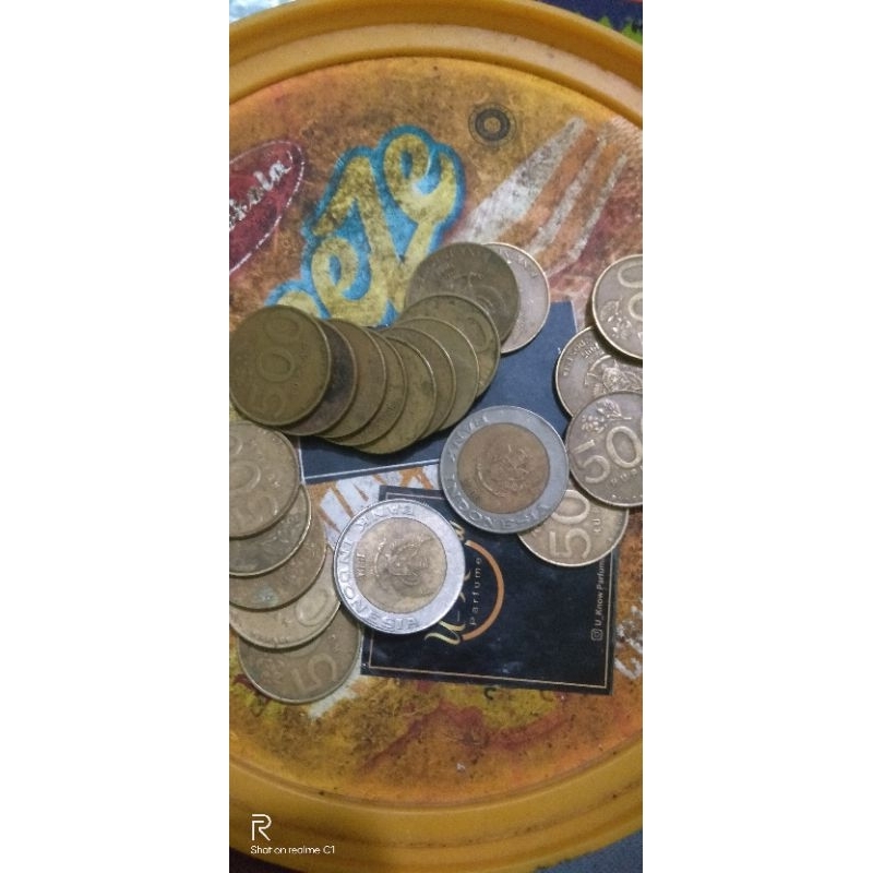 uang logam sawit Rp.1000 gambar sawit dan Rp500 melati