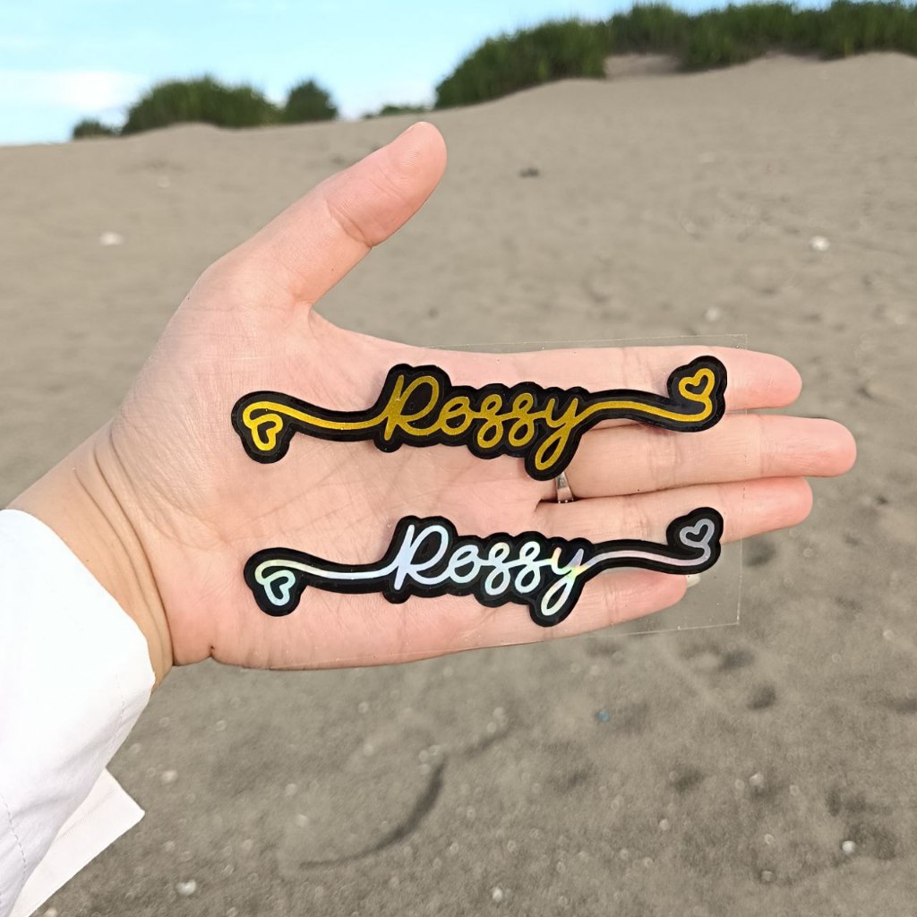 

CUTTING STICKER HOLOGRAM STIKER NAMA 2 WARNA