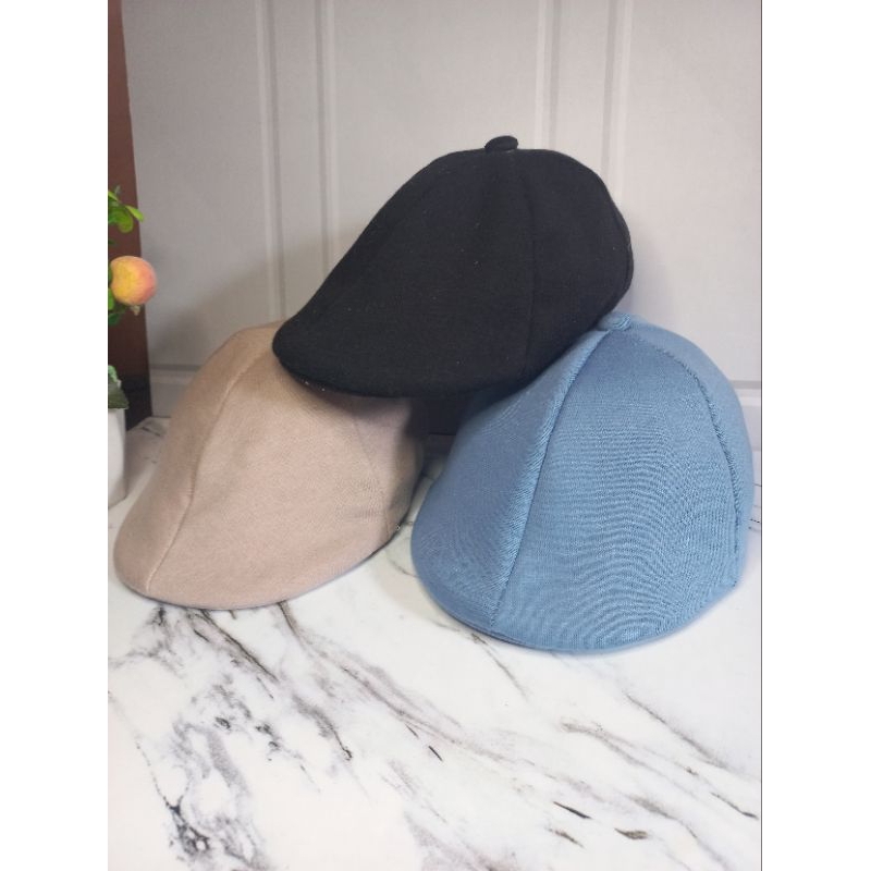 Topi model mazda kancing