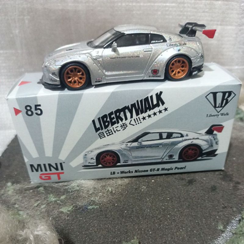Mini GT Nissan GT-R35 (LHD)-Magic Pearl ( Free Protektor)