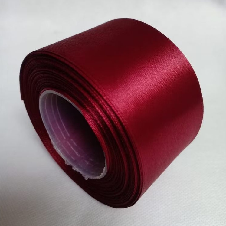 

Pita satin merah maron 1.5 inch / 3.81 cm Per roll