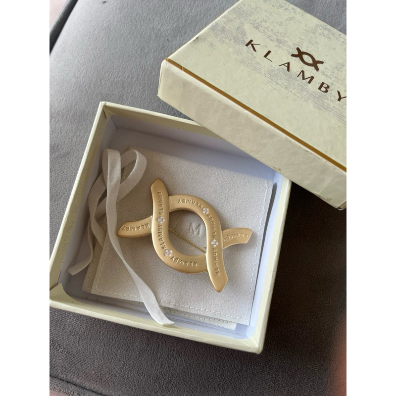 PL monogram gold brooch wearing klamby