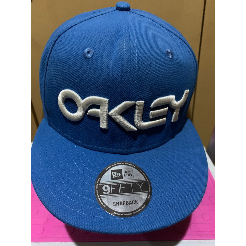 Topi Snapback sekon Oakley X New Era Biru Muda-100%original