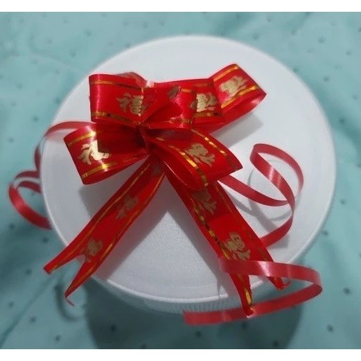 

PTI01 18 mm Pita Tarik Serut Imlek Sincia Fu Fuk Hoki Hiasan Parcel