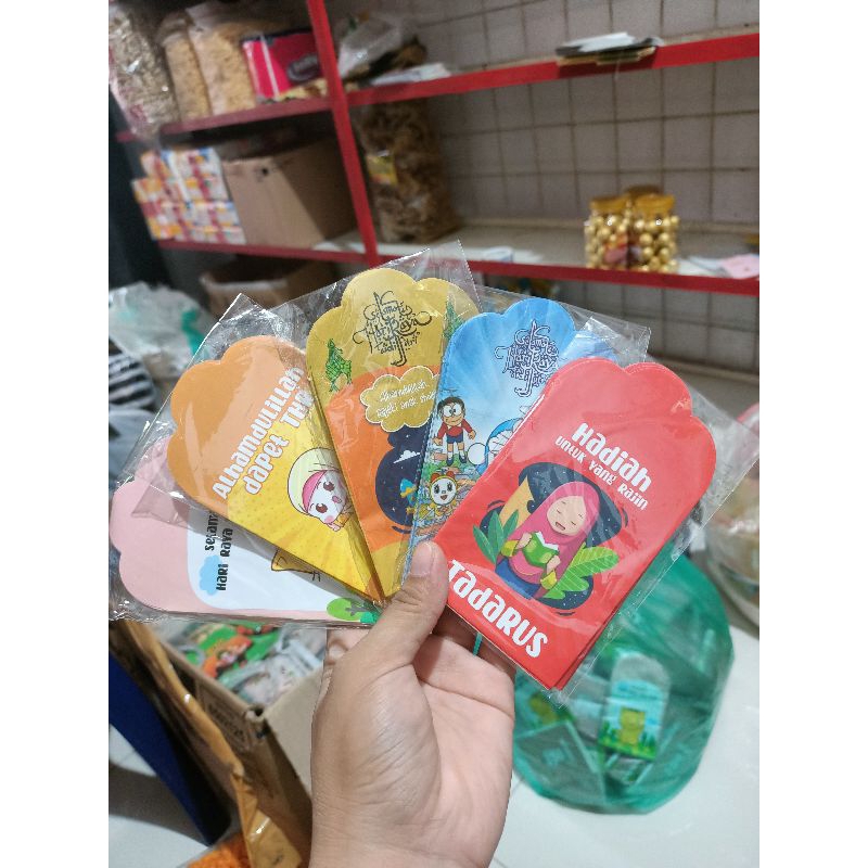 

Amplop lebaran medium karakter kartun glossy 7 x12 siap pakai sudah di lem