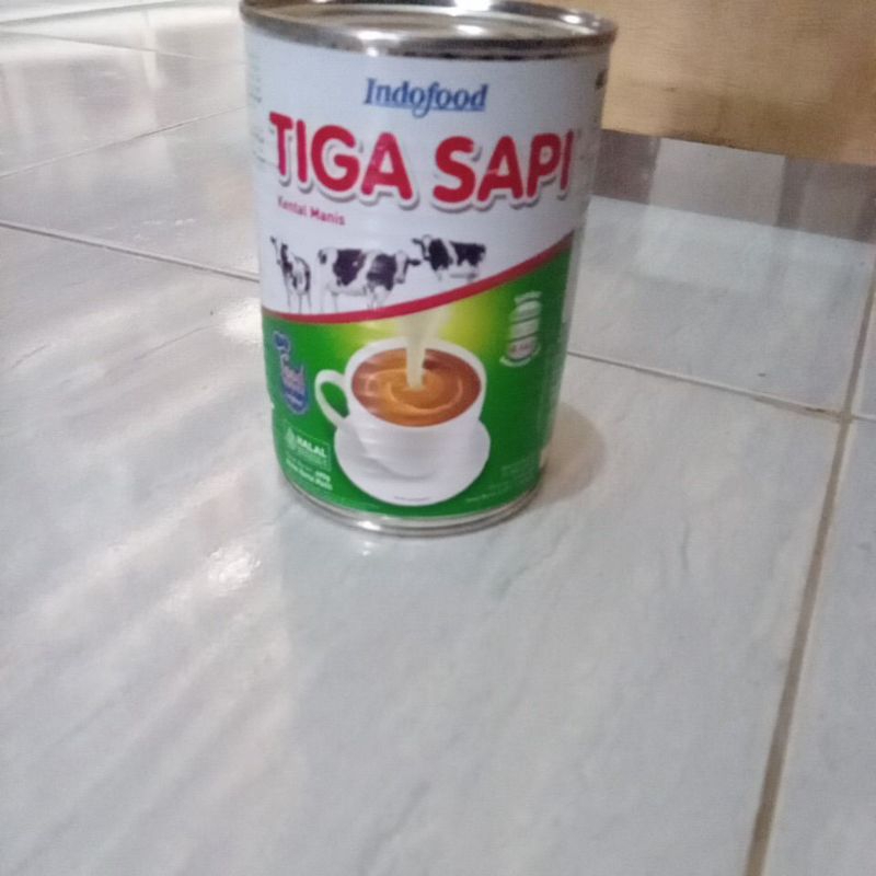 

tiga sapi kental manis
