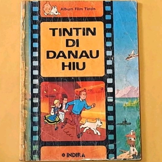 komik TINTIN DI DANAU HIU #1. Tintin album film. Indira.