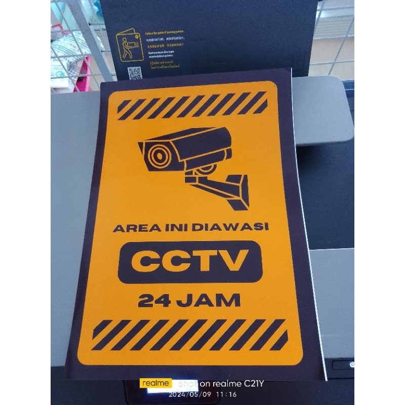 

sticker dengan tulisan"area ini diawasi cctv 24jam