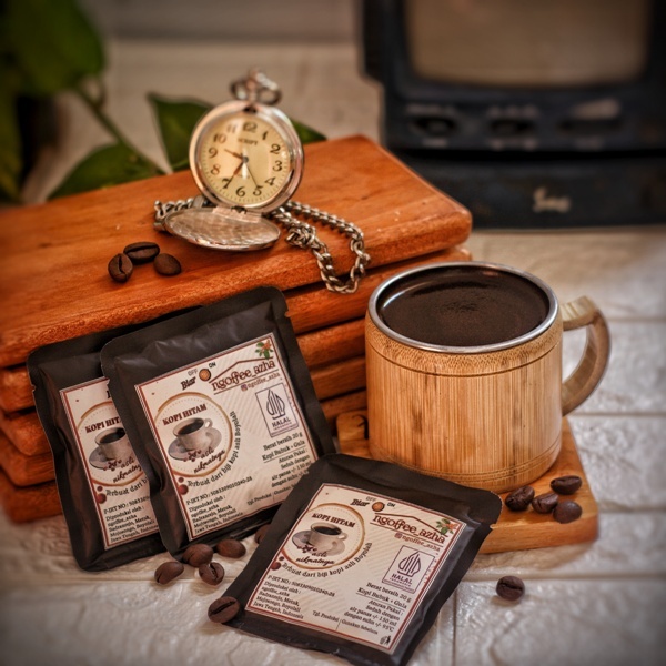 

Kopi bubuk dan gula kemasan sachet 100% kopi asli