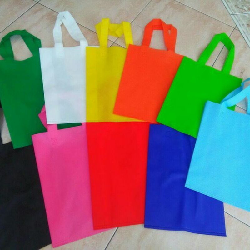 

tas kai spunbond lipat samping ukuran 30*10*40 isi 12 pcs