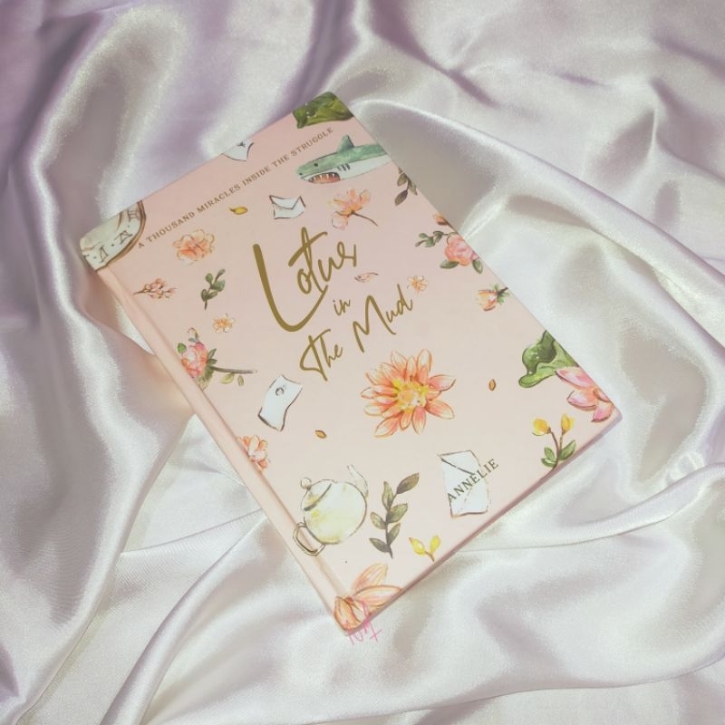 [BOOKED] PRELOVED LOTUS IN THE MUD HC VER PINK COVER (HARD COVER)