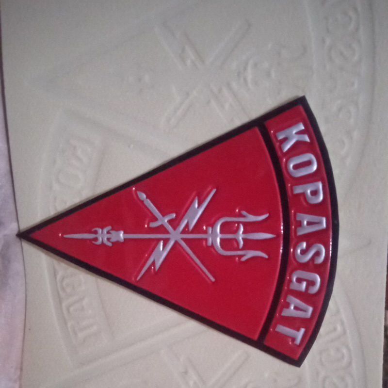 

Stiker embos Logo Kopasgat segitiga