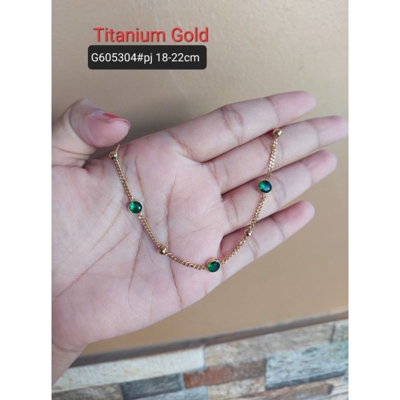 Gelang titanium batu mata hijau