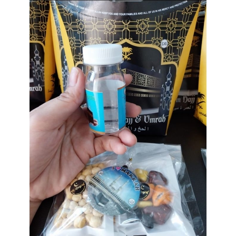 

Isi 10 Paket Oleh Oleh Haji & Umroh Isi Kismis,coklat krikil, kurma, air zam2 20ml dan tasbih/gantungan kunci