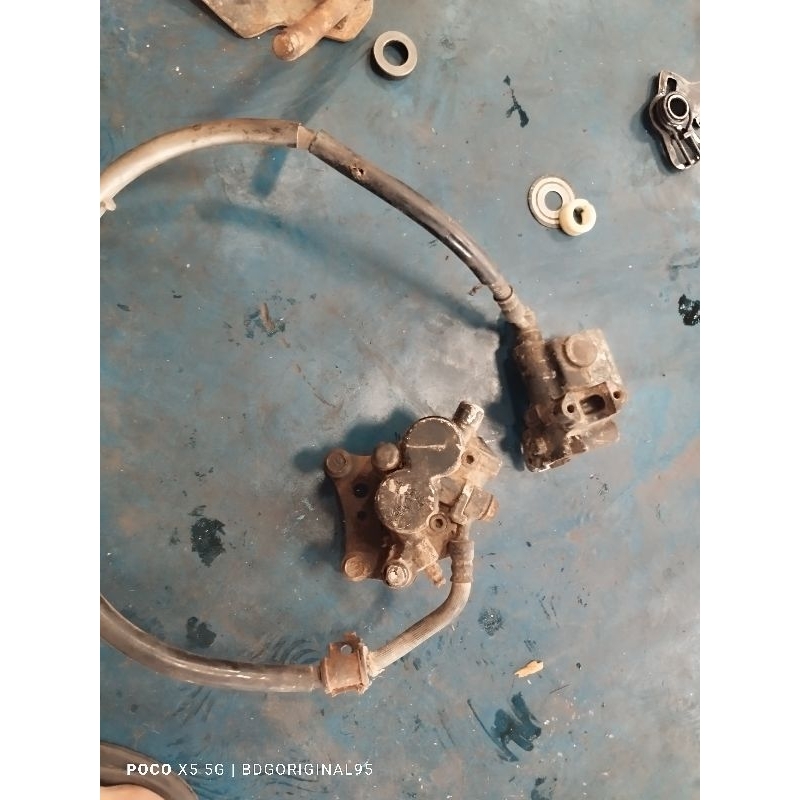 rem depan satria hiu lumba