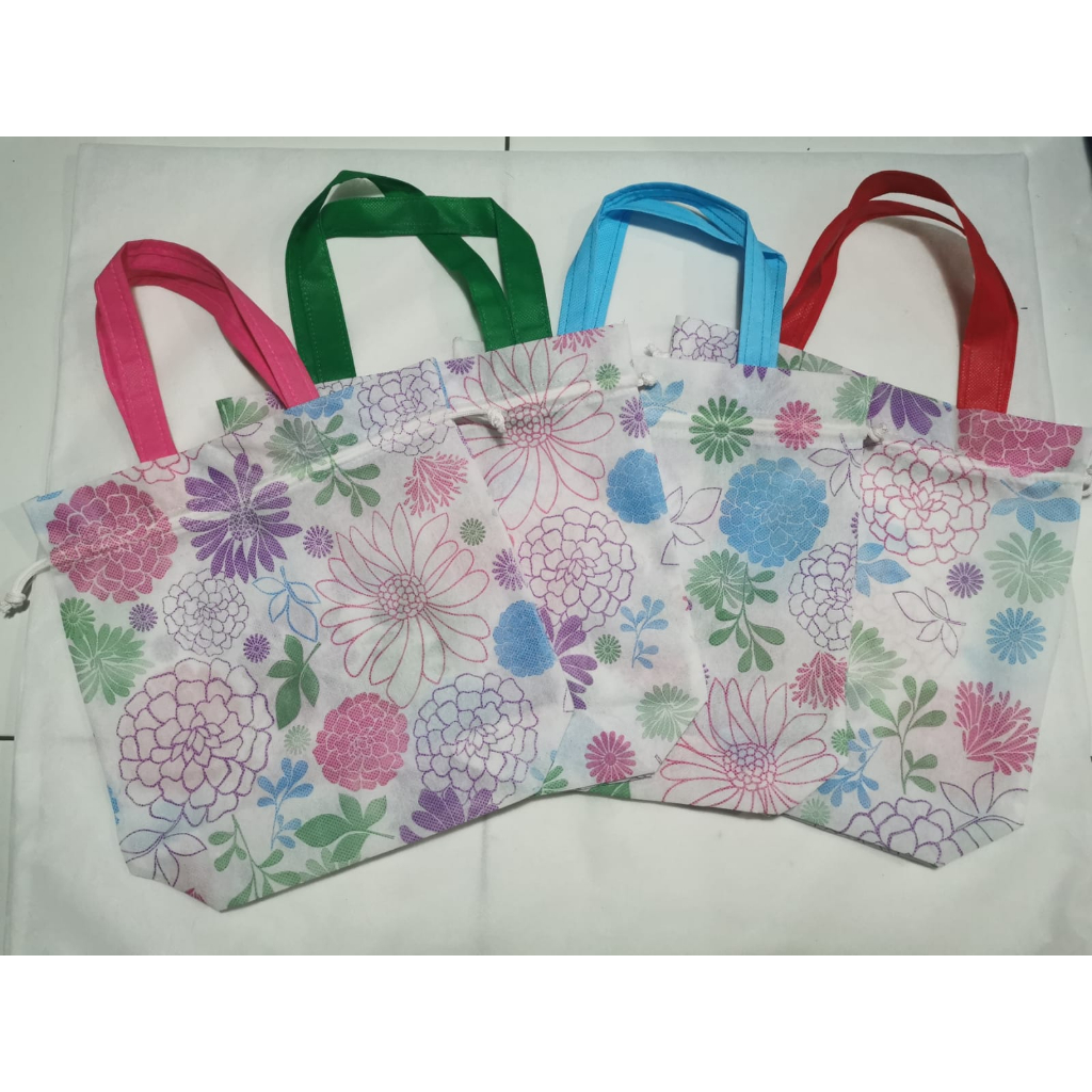 

TAS SPUNDBON SERUT NY MOTIF 25 X 27 CM PER 6 PCS - 12 PCS/GOODIEBAG/TAS SOUVENIR/TAS PROMOSI