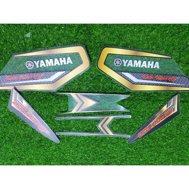 Striping transparan UV RX KING motif carbon gold