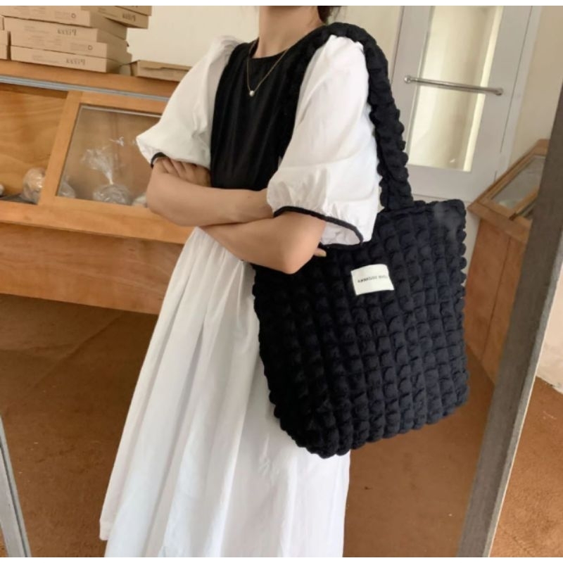 pluffy black bag