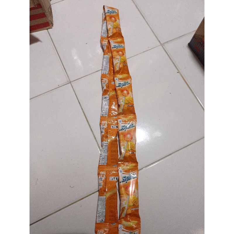 

Permen lolipop sunduk Split rasa mangga 1 renceng isi 12 pcs