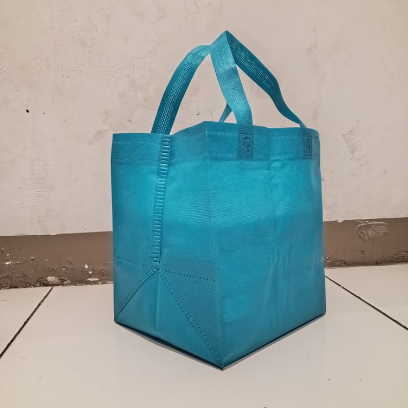 

tas spunbond box 22×20 kotak press isi 12pcs