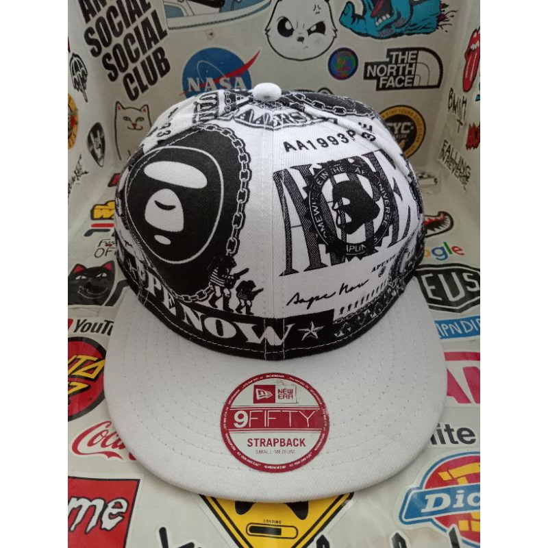 Topi strapback new era x aape full of print