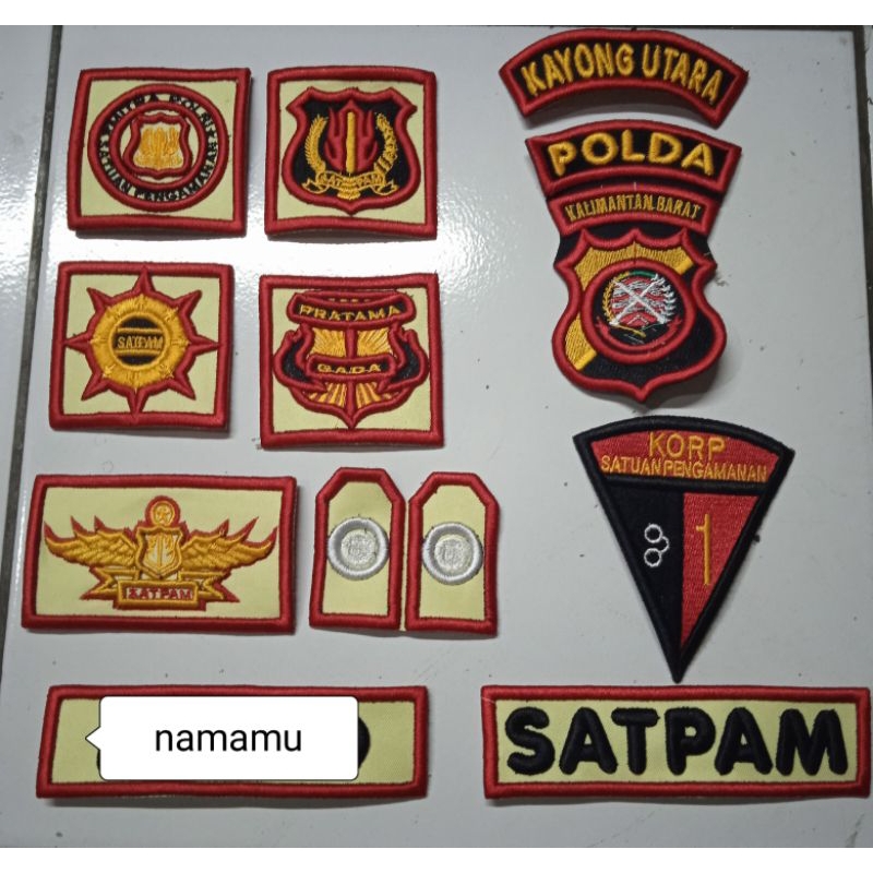 atribut satpam terbaru  dasar krem, bordir logo satpam, model terbari dasar krem