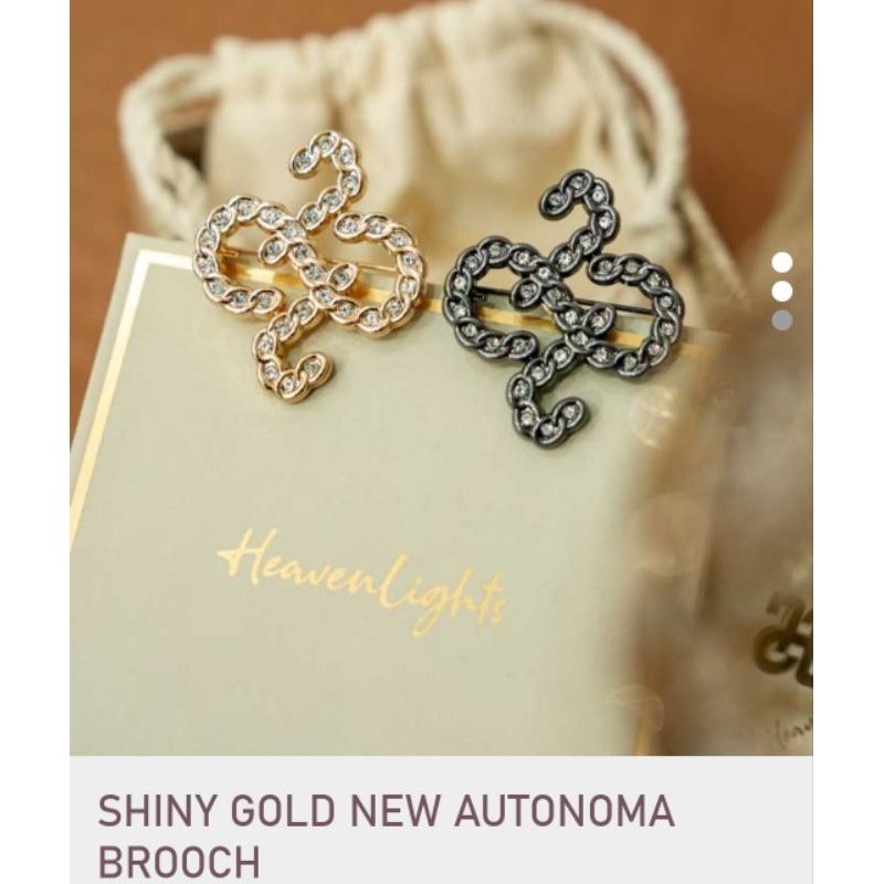shiny gold midnight new autonoma brooch by Heaven lights