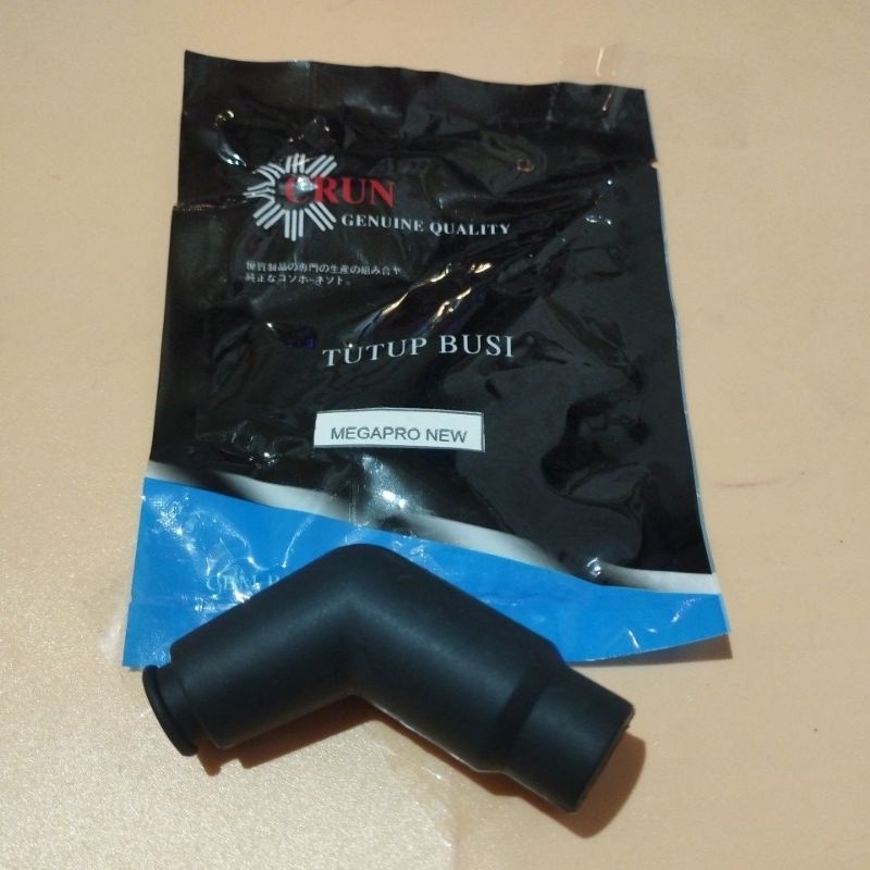 CRUN TUTUP BUSI MEGAPRO NEW /MEGAPRO MONO /COP BUSI MOTOR ORIGINAL