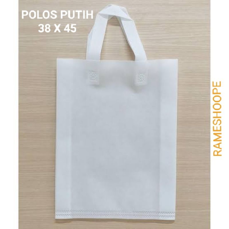 

goodie bag tas spunbond tali samping warna putih ukuran besar 38cm x 45cm daya angkut 8kg