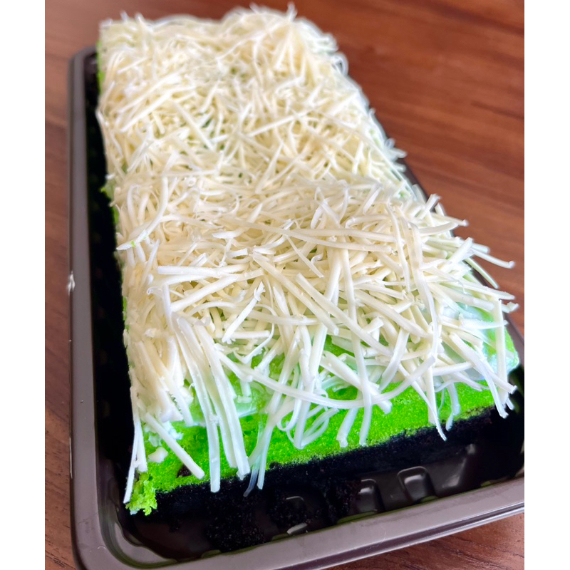 

PREMIUM BOLU KUKUS KETAN HITAM PANDAN PREMIUM TOPPING KEJU