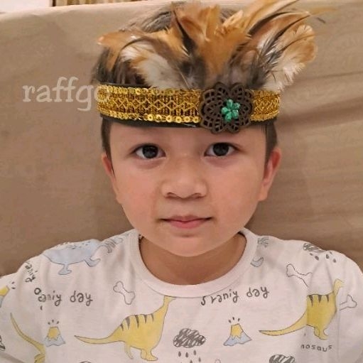 aksesoris topi bulu papua