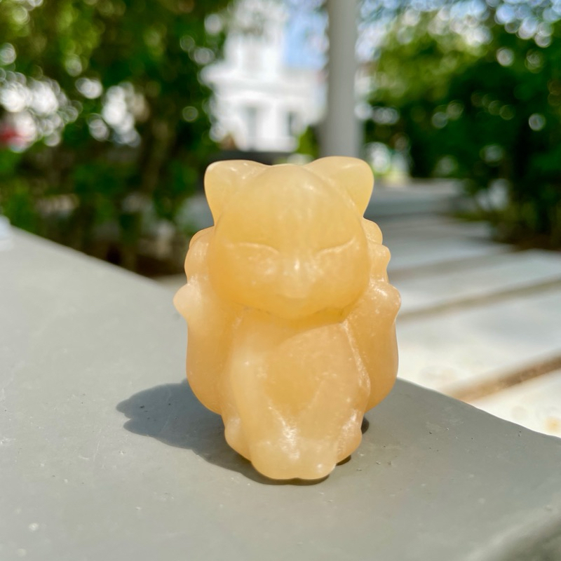 Yellow Calcite nine tailed fox carving