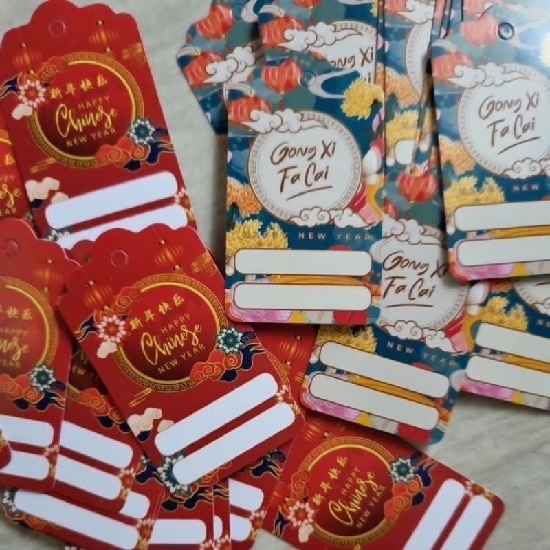 

tag imlek dengan pita merah emas untuk hampers kado gong xi fa chai