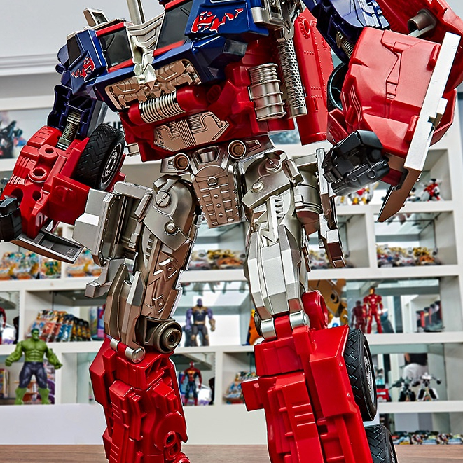 ★Mainan deformasi besar anak Optimus Car Column King Kong model robot Yuhu Bumblebee asli buatan tan